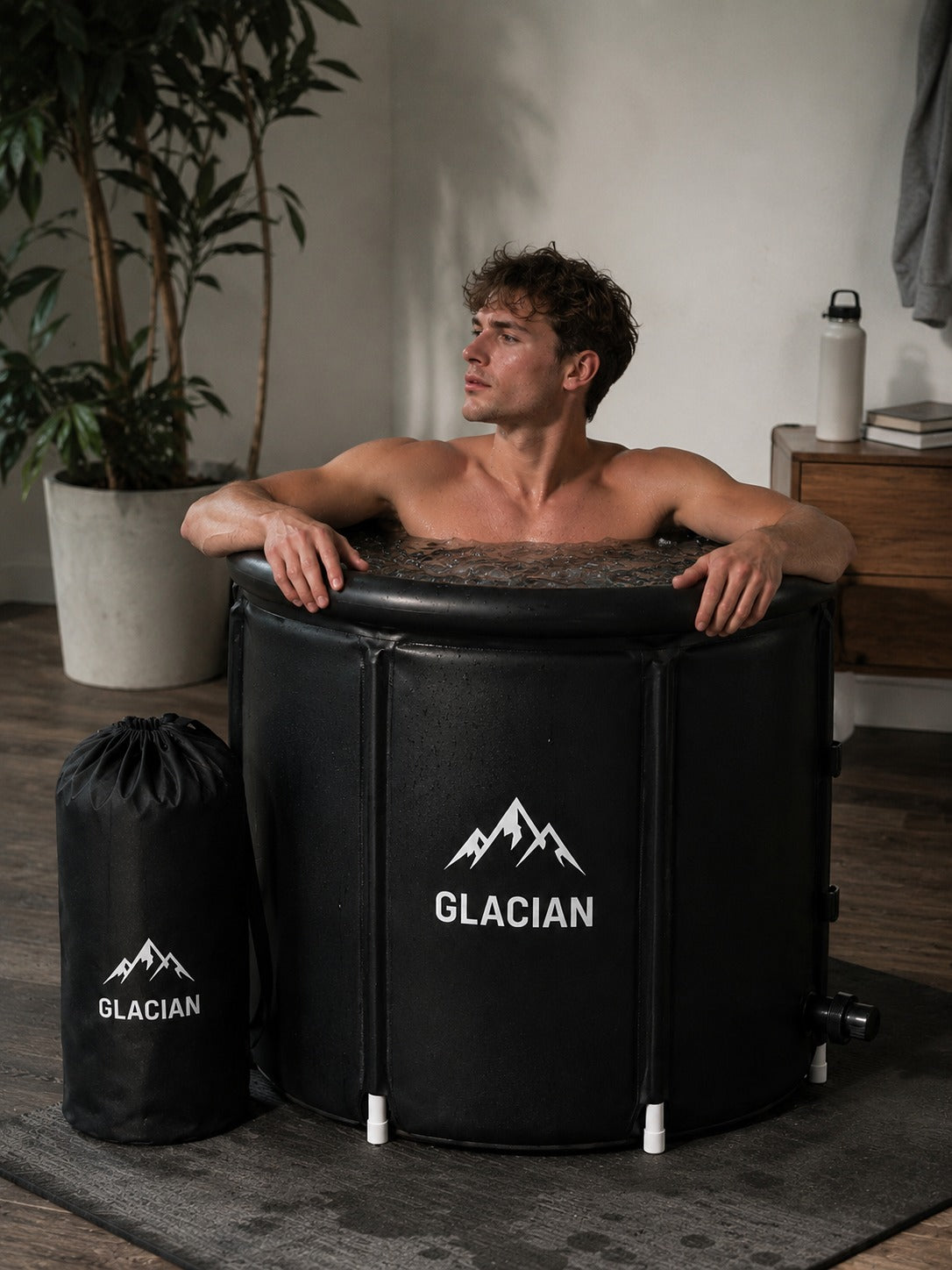 Man sitting in the Glacian cold plunge tub at home